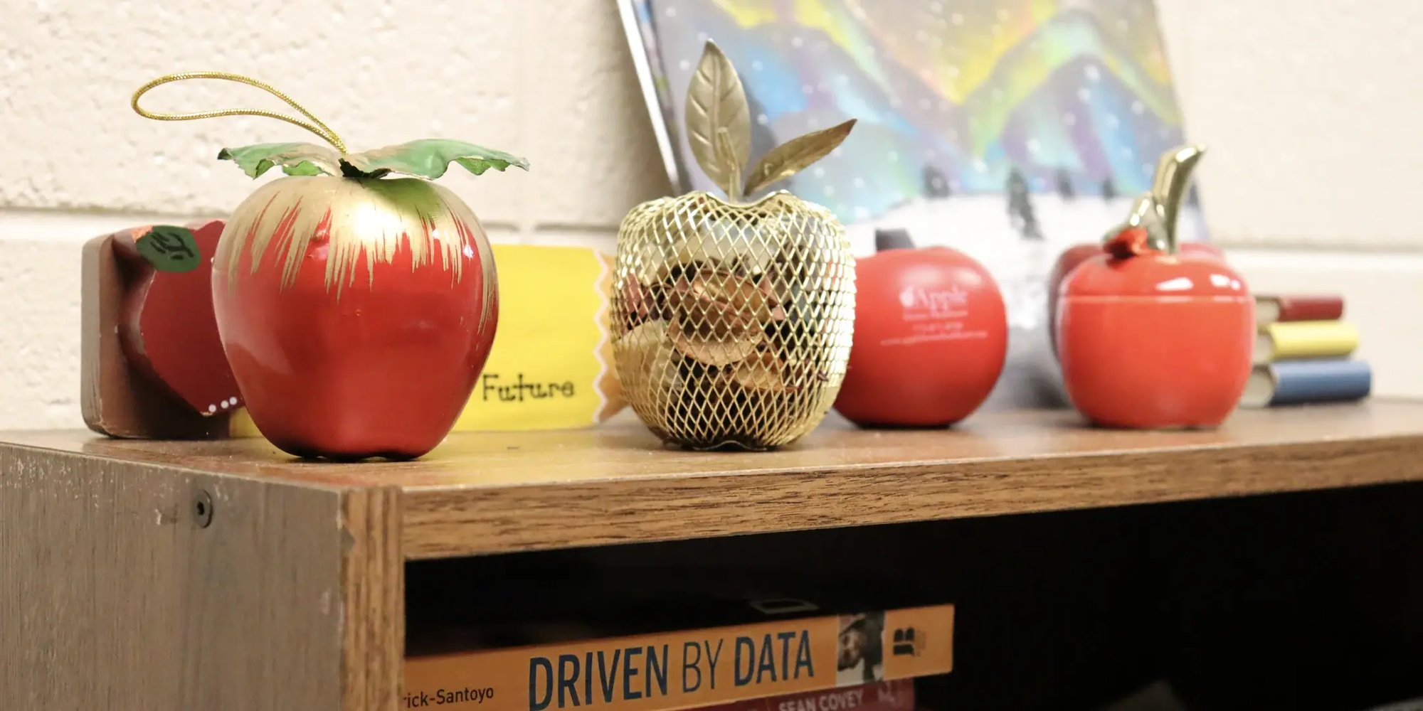 Apples on bookshelf