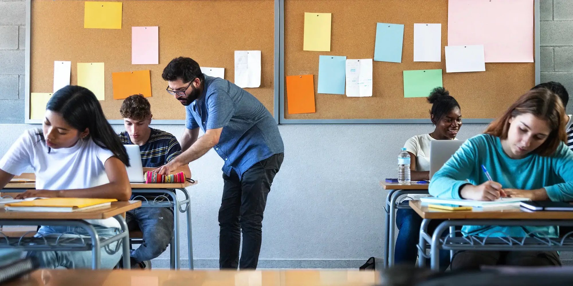 High school teacher helping student