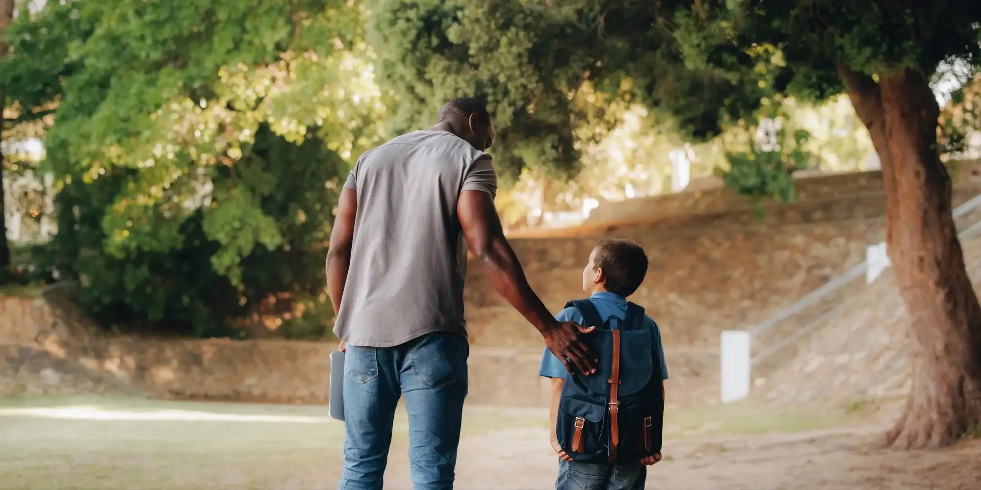 Teacher escorting a student